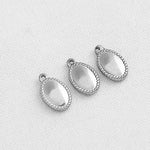 SG.218 // Surgical Steel Oval Serrature Pendant, 2Pc / P-SS-1171